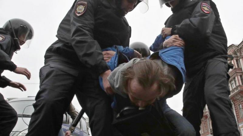 Russian police detain a protester at a demonstration against President Vladimir Putin in St.Petersburg, Russia, Saturday, May 5, 2018. A group that monitors political repression in Russia says more than 350 people have been arrested in a day of nationwide protests against the upcoming inauguration of Vladimir Putin for a new six-year term as president. (Photo: AP)