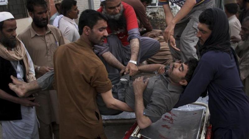 Pakistani volunteers and mine workers shift to their injured colleague on a stretcher upon arrival at a hospital in Quetta, Pakistan, Saturday, May 5, 2018. (Photo:AP)