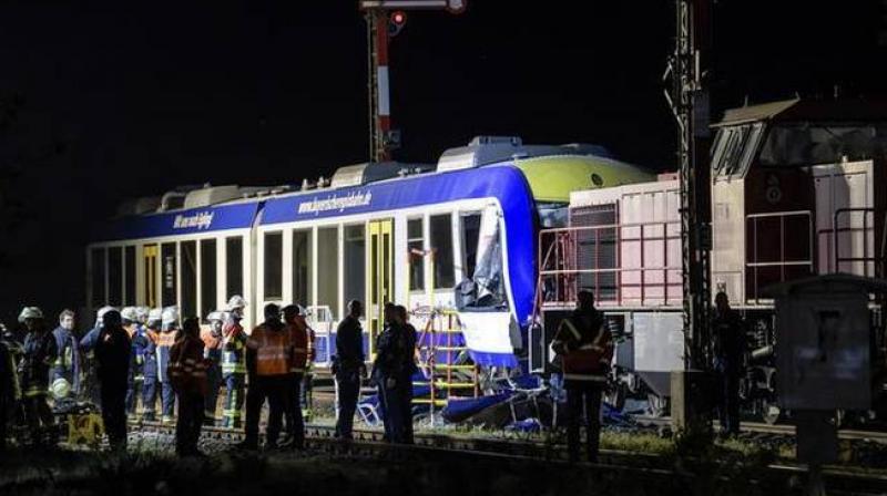 Emergency services attend the scene after a cargo train and a passenger train collided in Aichach, 50km west of Munich, southern Germany, Monday, May 7, 2018. (Photo:AP)