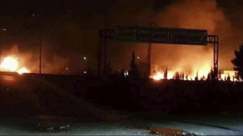 This photo released on May 9, 2018, by the Syrian official news agency SANA, shows flames rising after an attack in Kisweh, south of Damascus, Syria -- an area known to have numerous Syrian army military bases. (Photo: AP)