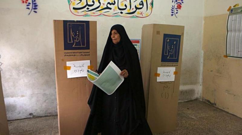 An Iraqi woman prepares to cast her vote in the countrys parliamentary elections in Baghdad, Iraq, Saturday, May 12, 2018. (Photo: AP)