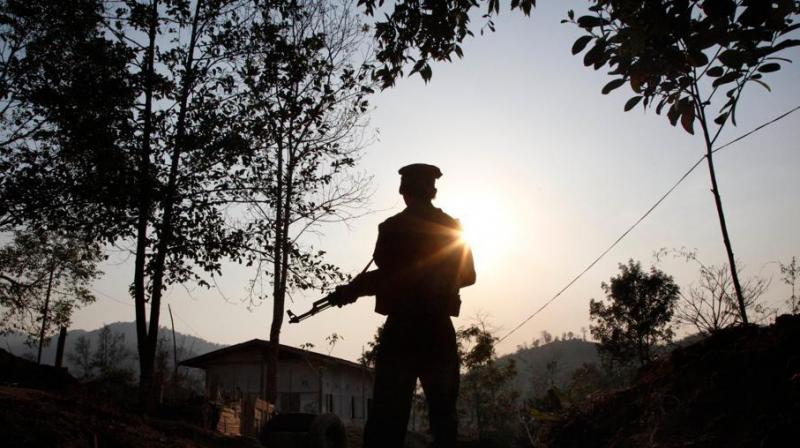 n this March 20, 2018 photo, a Kachin Independence army rebel stands at frontline outpost facing no mans land in Lawa Yang, outside of Laiza, the armed groups headquarters in northern Kachin state, Myanmar.(Photo: AP)