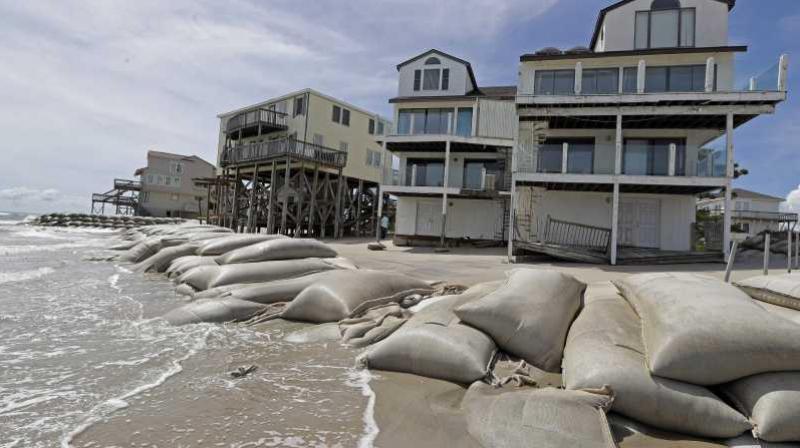 Sand bags surround homes on North Topsail Beach, N.C., Wednesday, Sept. 12, 2018, as Hurricane Florence threatens the coast. (Photo: AP)