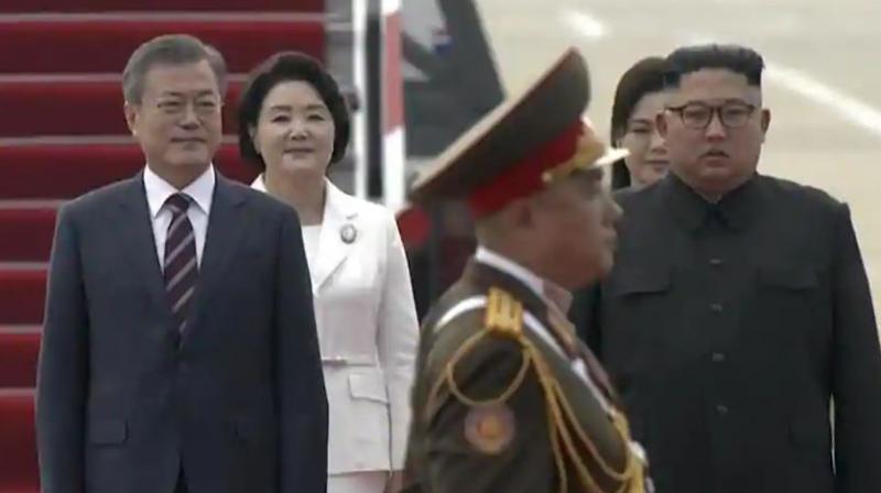 South Korean President Moon Jae-in, left, and his wife Kim Jung-sook, second from left, walk with North Korean leader Kim Jong Un and his wife Ri Sol Ju upon their arrival in Pyongyang, North Korea on September 18. (Photo: AP)