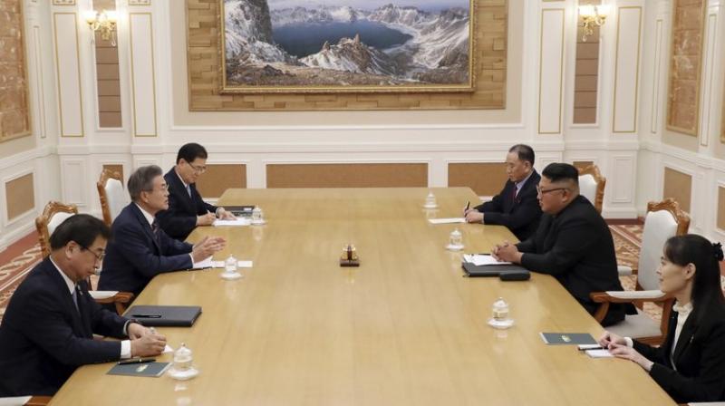 North Korean leader Kim Jong Un, right center, talks with South Korean President Moon Jae-in, left center, during their summit at the headquarters of the Central Committee of the Workers Party in Pyongyang, North Korea, Tuesday, Sept. 18, 2018.  (Photo: AP)