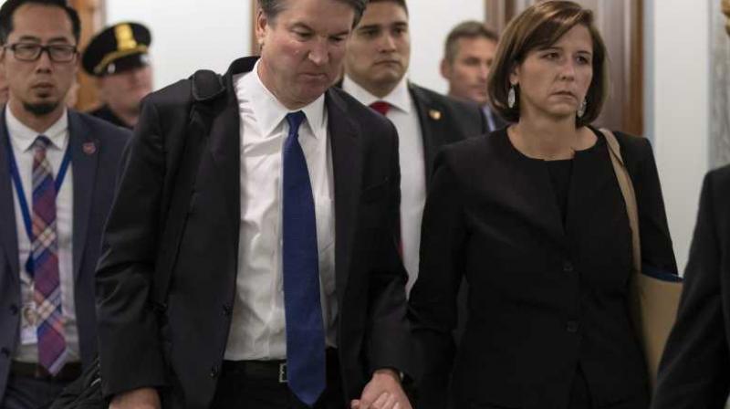 Supreme Court nominee Brett Kavanaugh and his wife Ashley Estes Kavanaugh depart after testifying before the Senate Judiciary Committee on Capitol Hill in Washington, Sept. 27, 2018. (Photo: AP)