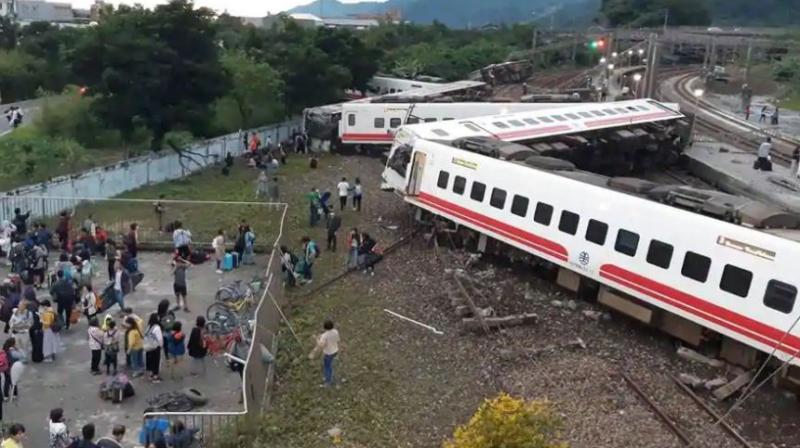 The government said the train had been carrying 366 people, and the Central News Agency said more than 30 were still trapped on board. (Photo: AP)