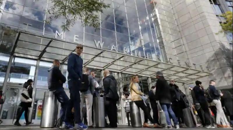 People gather outside the Time Warner Center, in New York on October 24.(Photo: AP)