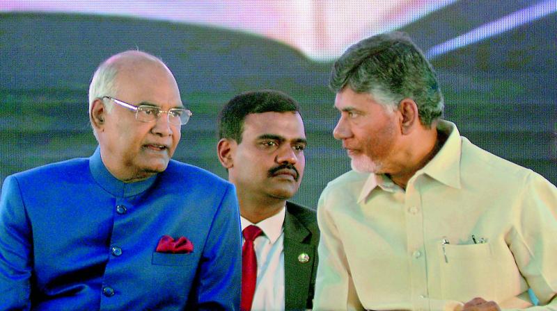 President Ram Nath Kovind and Chief Minister N. Chandrababu Naidu at the centenary meet of the Indian Economic Association at Guntur on Wednesday. (Photo: DC)
