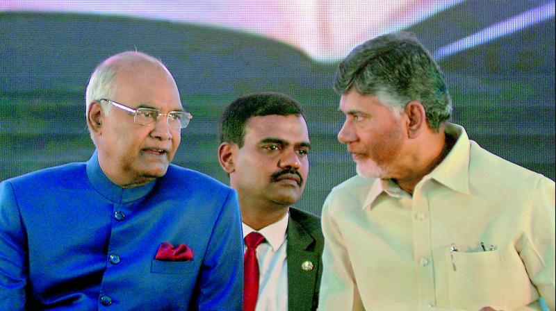 President Ram Nath Kovind and Chief Minister N. Chandrababu Naidu at the centenary meet of the Indian Economic Association at Guntur on Wednesday. (Photo: DC)