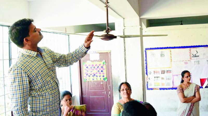 State Commission for Protection of Child Rights (SCPCR) incharge chairperon S. Balaraju inspects the room of Class X student K. Sai Charan who hanged himself at Ravindra Bharathi School in Moghalrajpuram in Vijayawada. (Photo: DC)