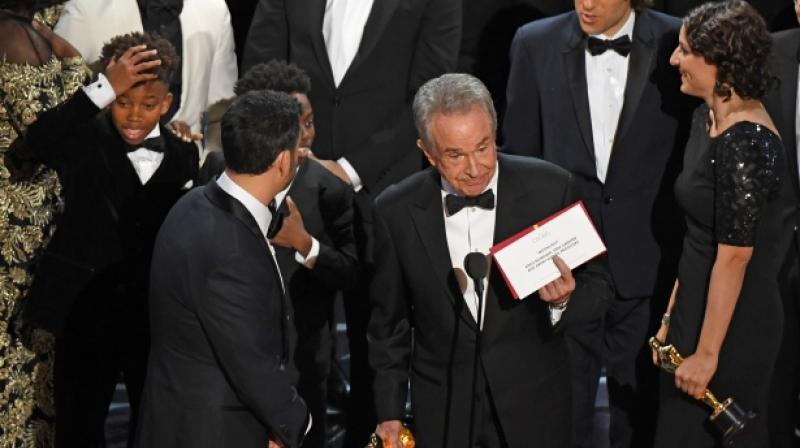 Warren Beatty holding the card reading Moonlight after he and Faye Dunaway had mistakenly announced La La Land as the winners.