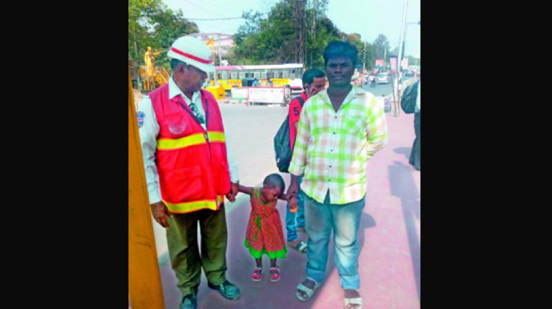 Jahangir Patel with the 4-year-old girl that he  rescued.