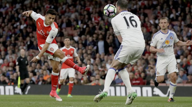 Two second half goals from star forward Alexis Sanchez helped Arsenal secure a 2-0  win over relegated Sunderland in the Premier League,  and keep their Champions League hopes alive on Tuesday night at the Emirates Stadium. (Photo: AP)