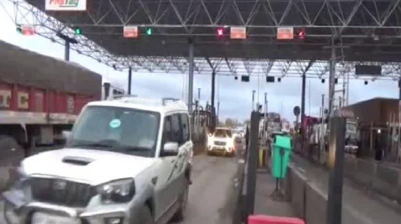 JD(U) MLA Ramchandra Prasad Singh along with his supporters crossed the toll bridge on National Highway in Rohtas without paying tax on Saturday. (Photo: ANI)