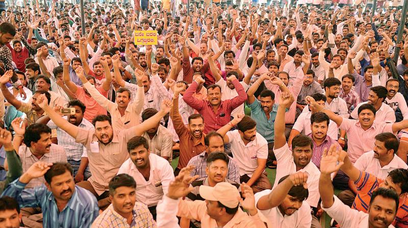 Ola and Uber cab drivers during their indefinite strike, at Freedom Park, in Bengaluru on Wednesday. (Photo: DC)