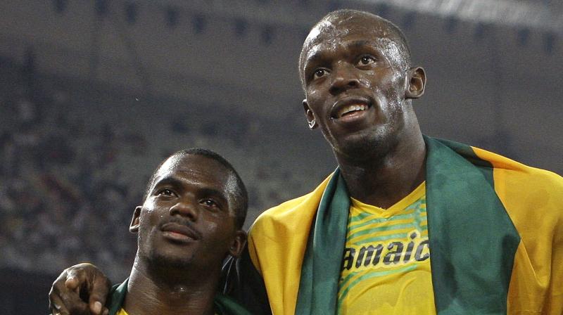 Usain Bolt and Nesta Carter. (Photo: AP)