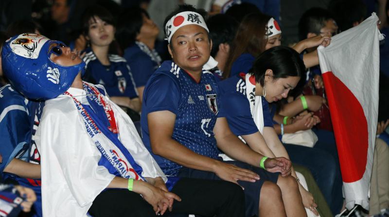 When the final whistle went with Belgium winning 3-2 to end Japans latest shot at World Cup history, fans sat in virtual silence, staring in disbelief at the screen. (Photo: AP)