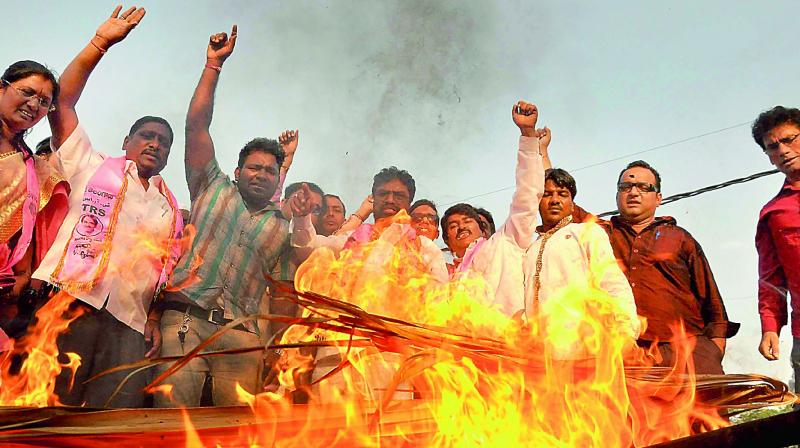 TRS activists burn an effigy of Congress senior leader Digvijay Singh in Hyderabad on Monday. (Photo: INN)
