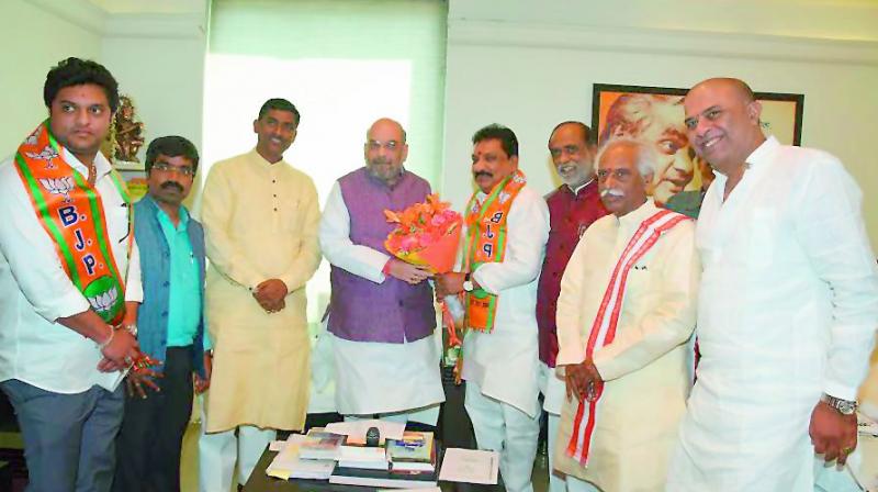 BJP national president Amit Shah welcomes former Patancheru Congress MLA Nandishwar Goud in the party fold in New Delhi on Monday in the presence of senior party leaders from TS Bandaru Dattatreya and Dr K. Laxman. (Photo: DC)