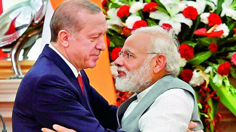 Prime Minister Narendra Modi greets Turkish President Recep Tayyip Erdogan on Monday. (Photo: PTI)