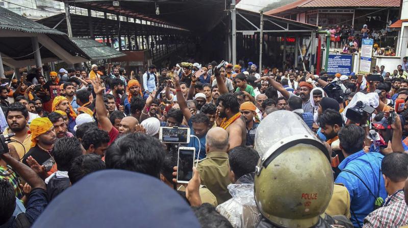 The tension was defused after the woman, who had come with her family members, convinced the protesters that she was above 50 years, and proceeded to the shrine. (Photo: PTI/File)