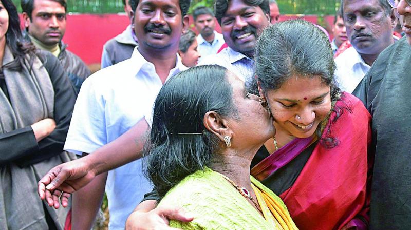 DMK MP Kanimozhi celebrates with her mother Rajathi Ammal after she was acquitted by a special court in the 2G scam case, in New Delhi on Thursday.