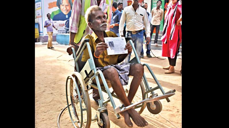 An elderly man is being wheeled into a booth in RK Nagar constituency. (Photos: N. SAMPATH and E.K. SANJAY)