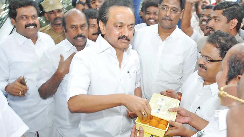 DMK working president M.K. Stalin celebrates with party cadres in Chennai on Thursday. (Photo: DC)