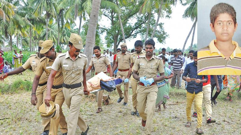 Policemen carry the body of schoolboy Santosh (inset), killed in a cellphone row near Katpadi in Vellore district on Thursday. (Photo: K. Senthil Nathan)