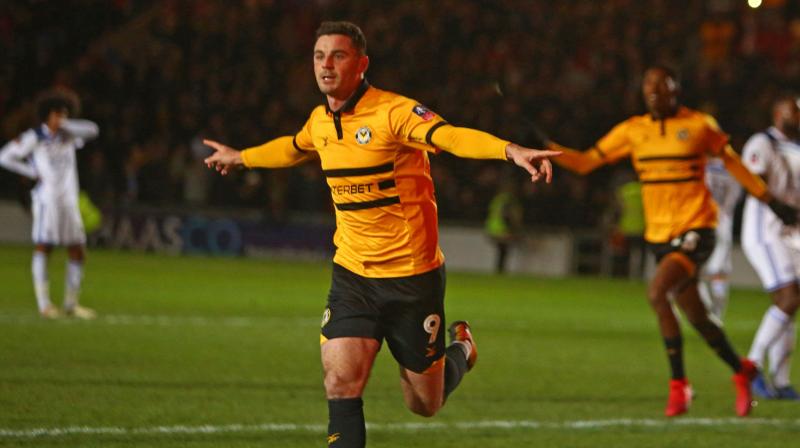 With five minutes left, Newport were awarded a penalty after Leicesters Marc Albrighton inexplicably raised his arm to block a cross into the box and Padraig Amond made no mistake from the spot to spark delirious scenes among the Welsh clubs supporters. (Photo: AFP)