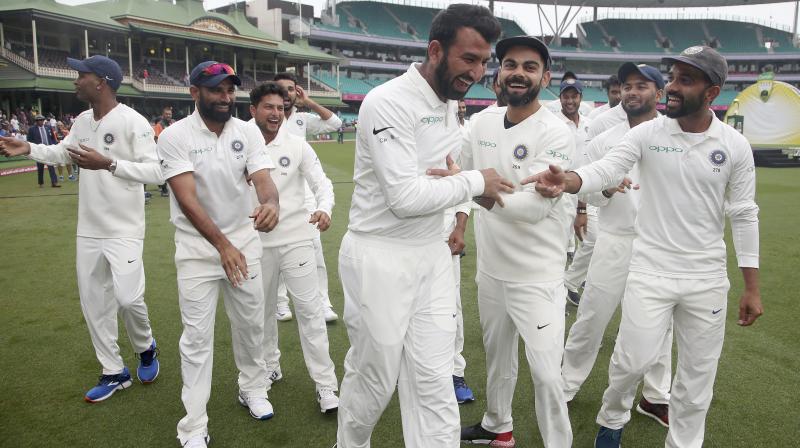 While player of the series Cheteshwar Pujara was seen dancing with his teammates, Kohli uploaded a celebratory post in Twitter. (Photo: AP)