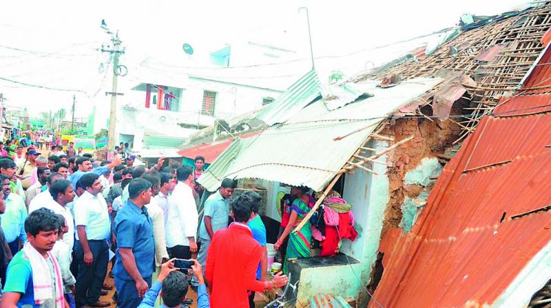 IT minister Nara Lokesh inspects the areas damaged by Cyclone Titli in Srikakulam district on Monday.  (DC)