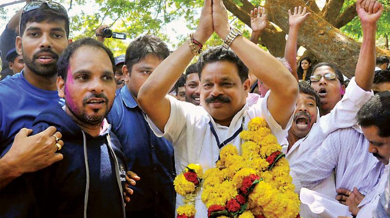 Congress candidate Dayanand Raghunath Sopte celebrates after defeating BJP leader and Goa Chief Minister Laxmikant Parsekar in the Assembly elections in Panaji on Saturday.