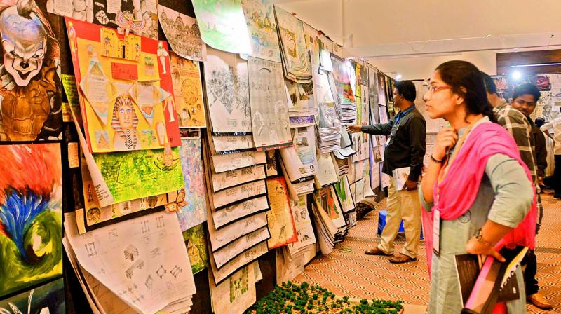 Students admire the designs on display at the Amaravati Design Festival-2019 at the CK Convention, Mangalagiri, near Vijayawada on Friday. (Photo:  Ch. Narayana Rao)