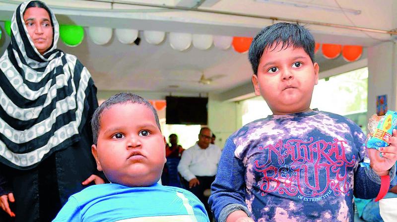 Two year-old Sk.Tabish (Wt: 32 kg) and five-year-old Sk. Sufia (Wt 42 kg) suffer from leptin deficiency and seek governments help for treatment. (Photo: DC)