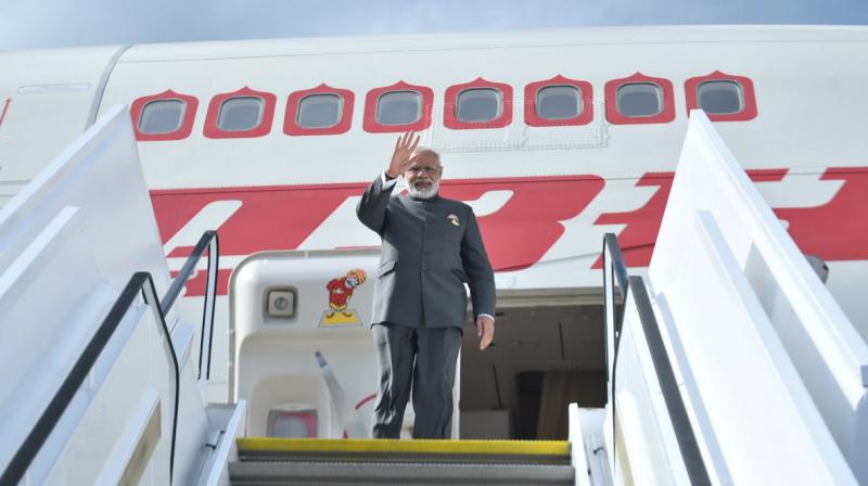 Prime Minister Narendra Modi before boarding the plane for departure. (Photo: Twitter | Gopal Baglay)