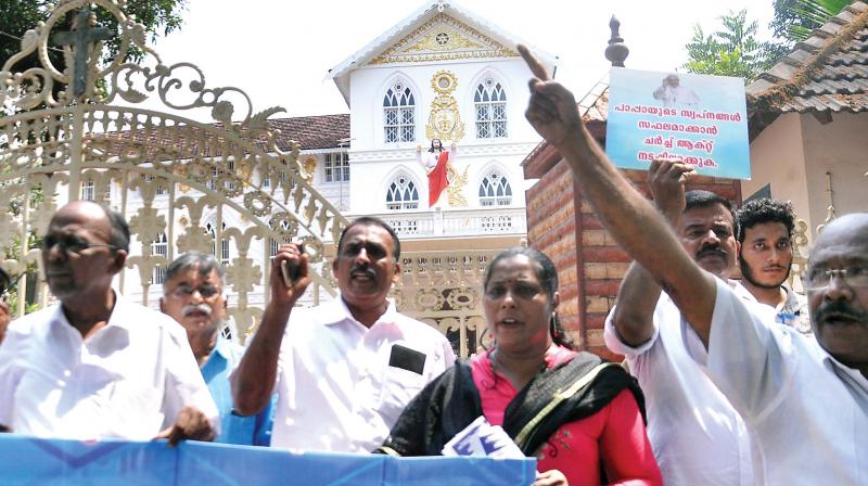 A group of faithful stages a protest in front of Major Archbishops house in Ernakulam demanding implementation of the Church Act in Kochi.