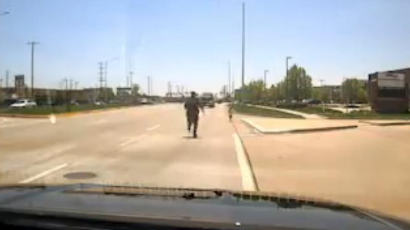 Brave police officer rescue toddler from oncoming traffic. (Photo: Facebook / Naperville Police Department)