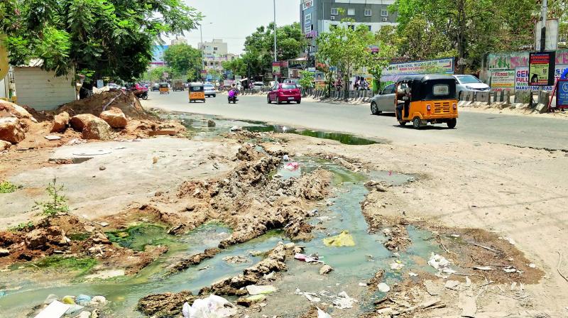 Sewage overflow on to the road after construction of a box drain near Kondapur RTA office stopped. (Photo: DC)