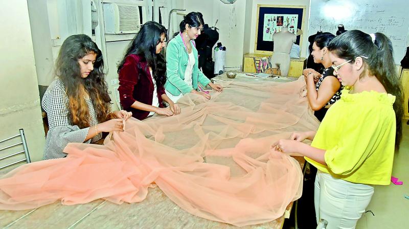 Students of the college preparing for the annual fashion show.