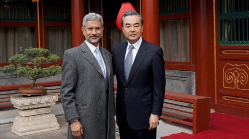 Foreign Secretary, S. Jaishankar with Chinese Foreign Minister Wang Yi. (Photo: PTI)