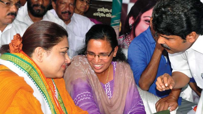 Kozhikode DCC president T. Siddique intervenes while AICC spokeperson and actor Kushboo having a word with RMP leader K.K Rema at a protest meet organised by DCC on Wednesday. (Photo: VENUGOPAL)