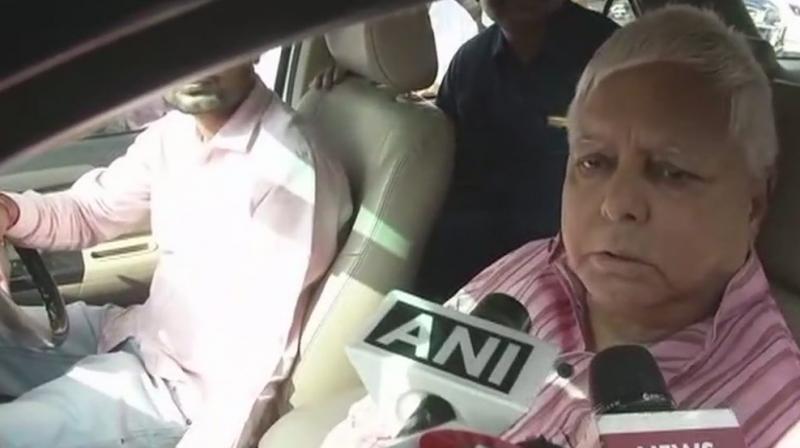 RJD Chief Lalu Yadav gave the statement in Patna on Wednesday before leaving for Ranchi. (Photo: Twitter | ANI)