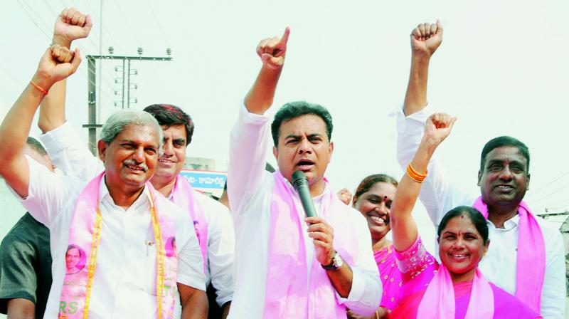 Minister K.T. Rama Rao participates in road show as part election campaign at Vemulawada in Rajanna Sircilla district  on Wednesday.  (DC)