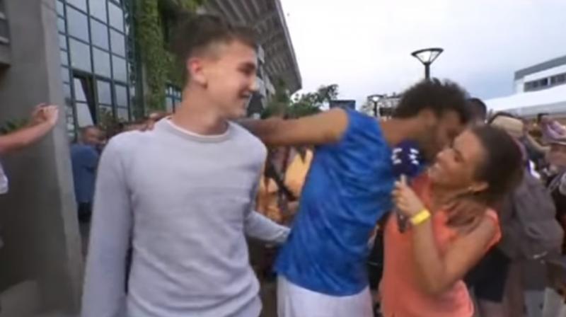 Maxime Hamou, 21, grabbed Eurosport journalist Maly Thomas around the neck and shoulders while she interviewed him following his first round defeat. (Photo: Screengrab)