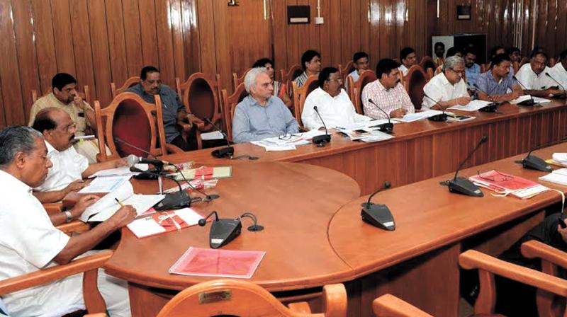Chief Minister Pinarayi Vijayan chairing meet of State NH, NHAI officials and district collectors in Thiruvananthapuram on Tuesday. Also seen are PWD minister G. Sudhakaran and Additional chief secretaryP. H. Kurian. (Photo: DC)