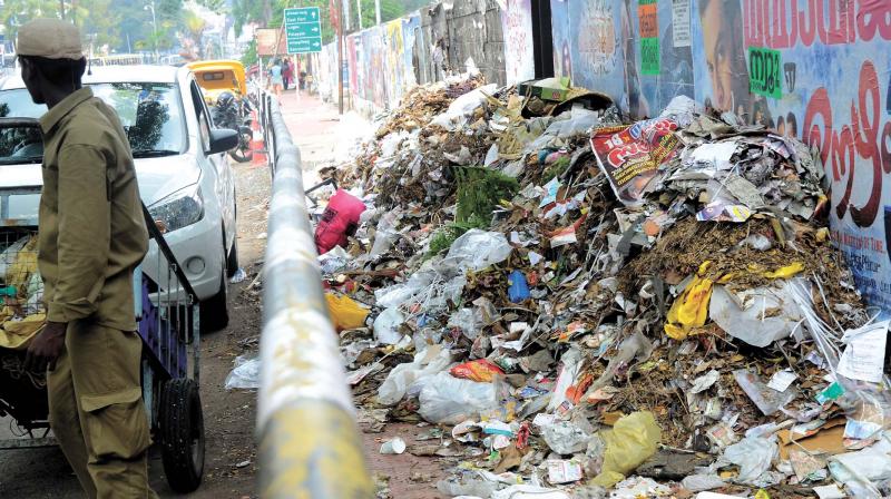 Corporation staff dump waste by th way side. 	(Photo:  Peethambaran Payyeri)