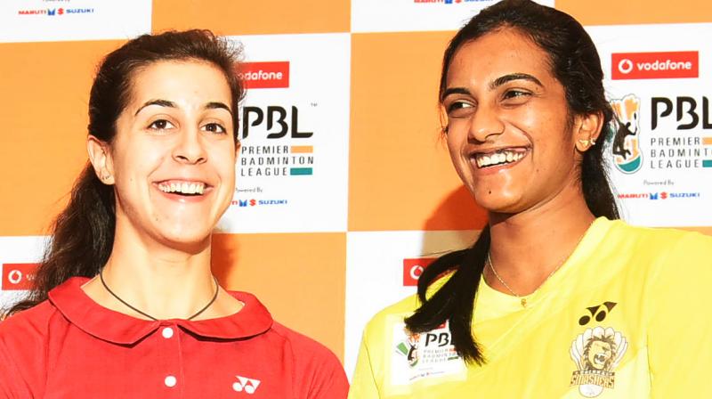 Sindhu and Marin in all smiles sharing the moments of joy in the trophy unveiling event on Friday at Hotel Trident, Hyderabad (Photo: R. Pavan)