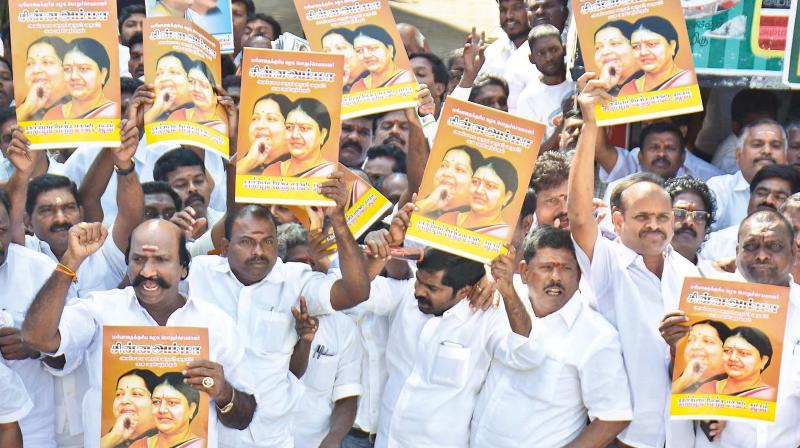 Party cadres show posters to support Sasikala as general secretary at AIADMK office at Royapettah on Saturday (Photo: DC)